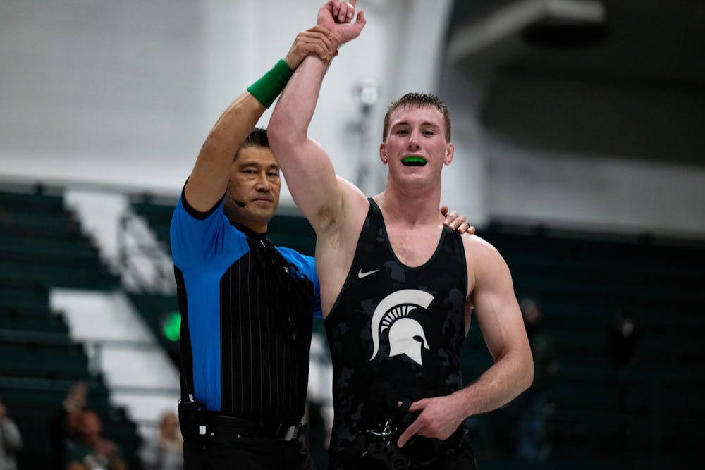 <p>Michigan State’s Kael Wisler (197) celebrates after his victory as the referee raises his hand during a dual against Illinois at Jenison Field House in East Lansing on Friday, Jan. 16, 2026.</p>