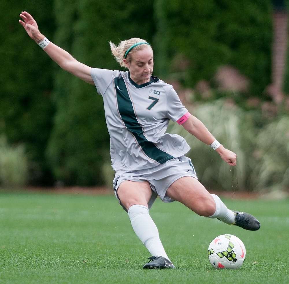 <p>Junior defender Mary Kathryn Fiebernitz kicks the ball during the game against Nebraska on Oct. 5, 2014, at DeMartin Soccer Stadium at Old College Field. The Spartans defeated the Cornhuskers, 3-1. Jessalyn Tamez/The State News</p>