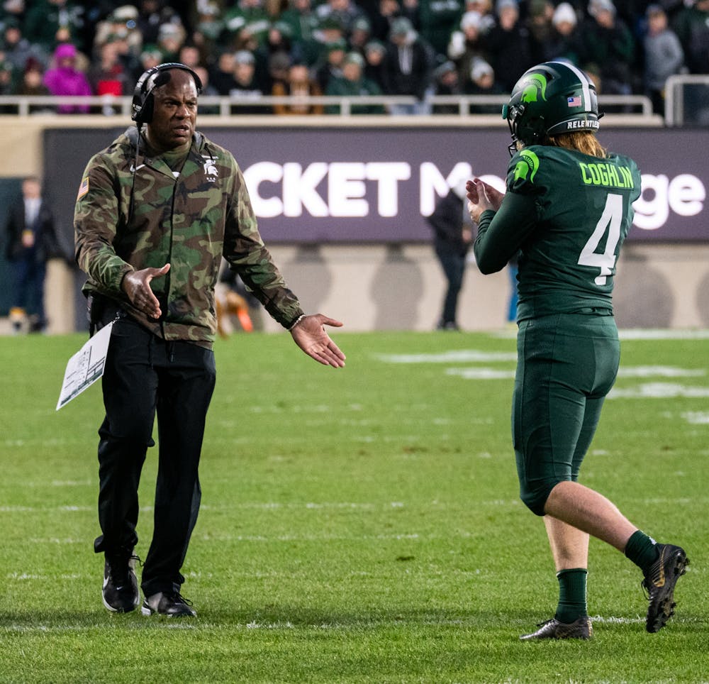 <p>Head Coach Mel Tucker applauds graduate kicker Matt Coghlin (4) as he returns to the sidelines during Michigan State&#x27;s victory over University of Maryland on Nov. 13, 2021.</p>