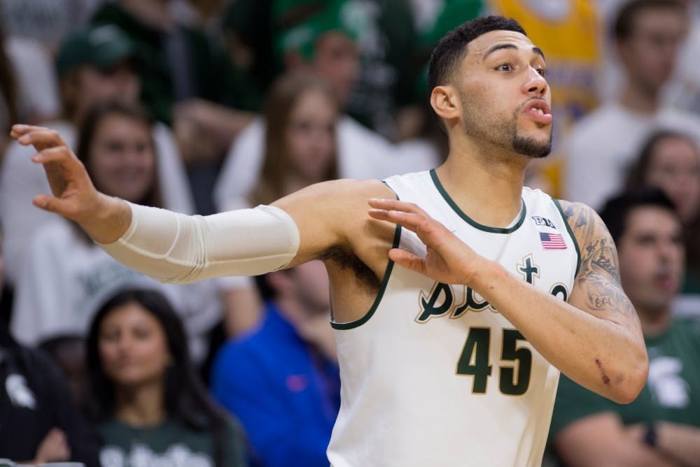 Senior guard Denzel Valentine talks to his team from the bench on Dec. 12, 2015 during the game against Florida at Breslin Center. The Spartans defeated the Gators, 58-52.