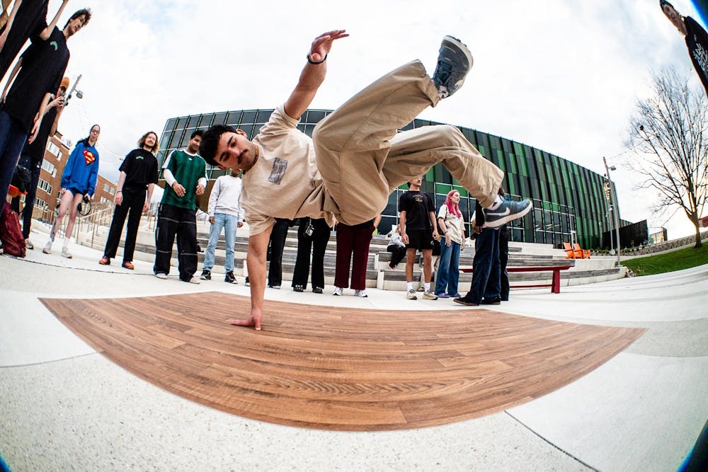 <p>A dancer performs in front of a crowd during the MSU Breakdancing Club’s 1v1 dance battle held outside of the Multicultural Center in East Lansing, Michigan on Tuesday, April 21, 2026.</p>