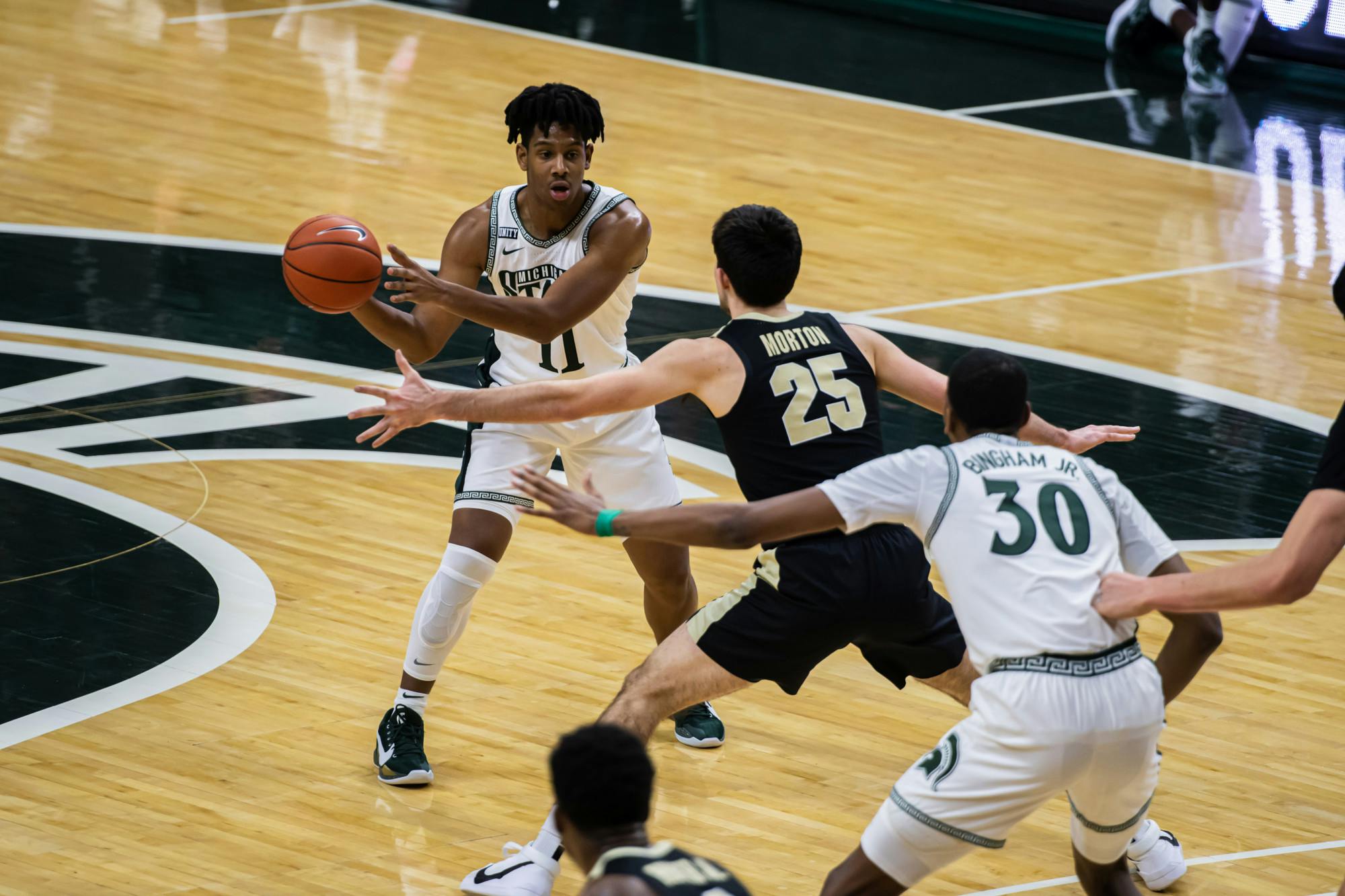 <p>Freshman guard A.J. Hoggard passes the ball during the Spartans&#x27; 55-54 loss to Purdue on Jan. 8, 2021.</p>