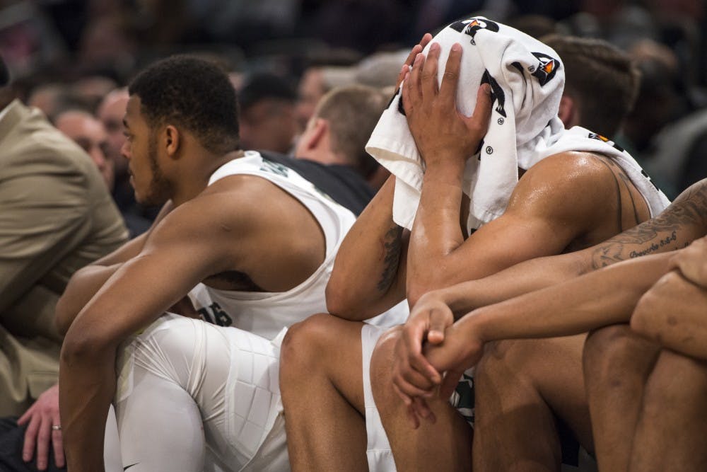 Sophomore wing Miles Bridges (22) rests his face against his hands during the second half of the 2018 Big Ten Men's Basketball semifinal game against Michigan on March 3, 2018 at Madison Square Garden in New York. The Spartans were defeated by the Wolverines, 75-64. (Nic Antaya | The State News)