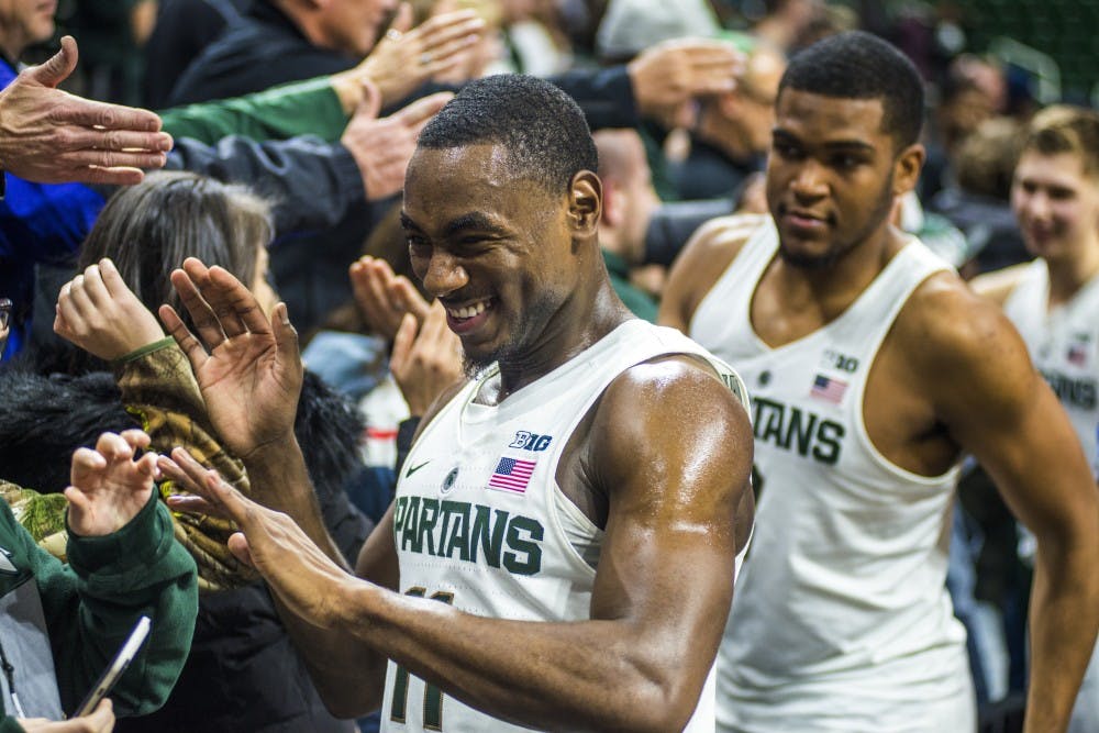 Junior guard Lourawls Nairn Jr. (11) high fives fans after the men's basketball game against Rutgers on Jan. 4, 2017 at Breslin Center. The Spartans defeated the Scarlet Knights, 93-65.
