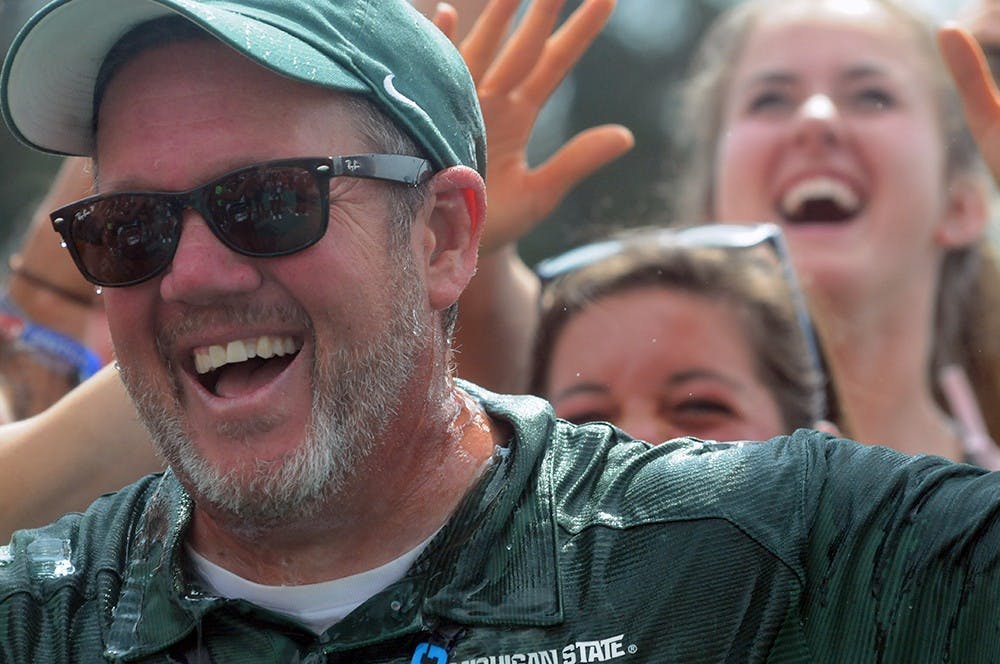 <p>Director of Track and Field and Cross Country for Michigan State University Walt Drenth celebrates the women&#x27;s team winning conference champions as he is doused with Gatorade at the Big Ten Conference Championships on May 17, 2015, at Ralph Young Field. Wyatt Giangrande/ State News</p>