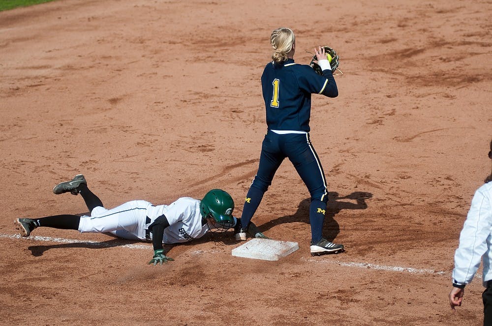 	<p>Sophomore first baseman McKinzie Freimuth slides into third base during the game against Michigan, April 14, 2013, at Secchia Stadium at Old College Field. Katie Stiefel/The State News</p>