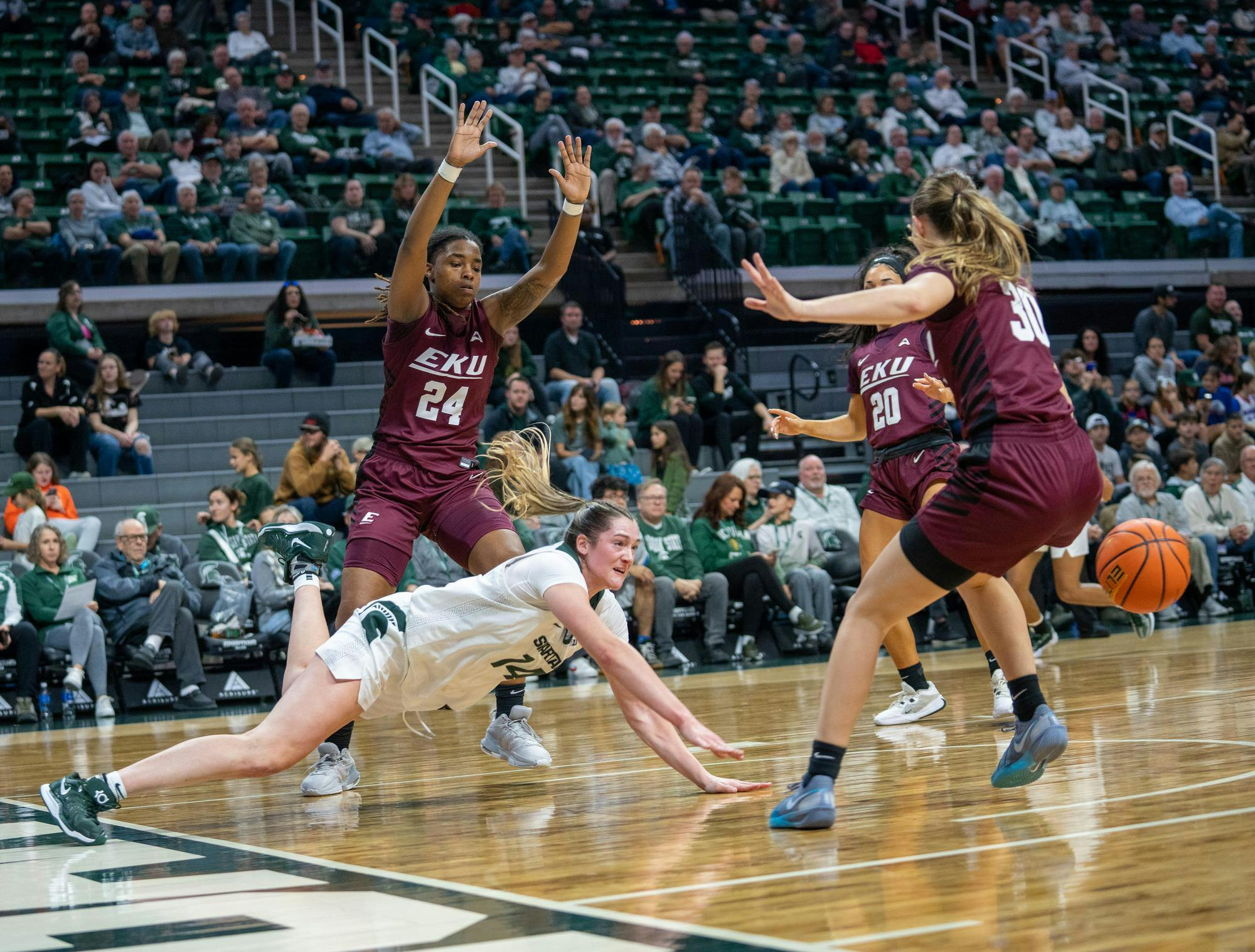 MSU Junior forward Grace VanSlooten (14) is fouled by an opposing player during a timeout as they play against Eastern Kentucky at the Breslin Center on Nov. 14, 2024.