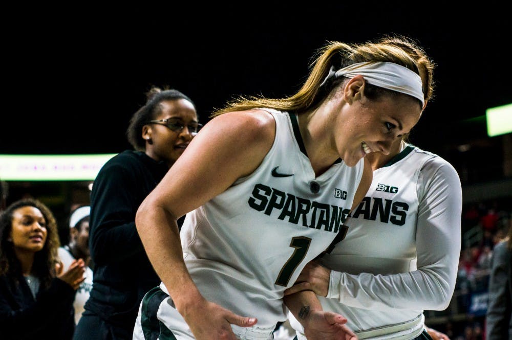 Senior guard Tori Jankoska (1) smiles as she jogs off the court after the second quarter of the women's basketball game against Ohio State on Jan. 10, 2017 at Breslin Center. The Spartans defeated the Buckeyes, 94-75. Jankoska scored 42 points against the Buckeyes. 
