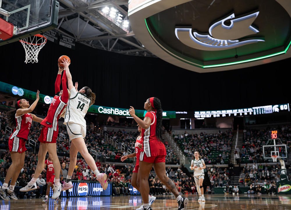 <p>Grace VanSlooten (14), senior forward for Michigan State University, goes for a shot against Ohio State University at the Breslin Center in East Lansing, Michigan on Sunday, Mar. 1, 2026.</p>