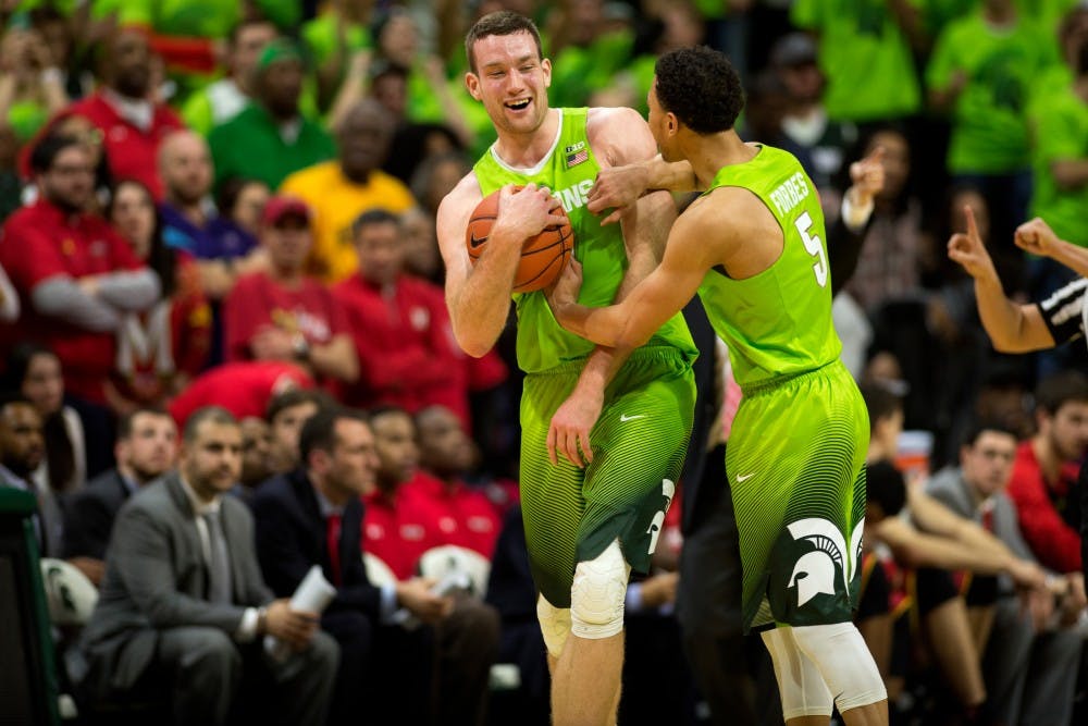 Senior forward Matt Costello celebrates with senior guard Bryn Forbes during the  game against Maryland on Jan. 23, 2016 at Breslin Center. The Spartans defeated the Terrapins, 74-65.