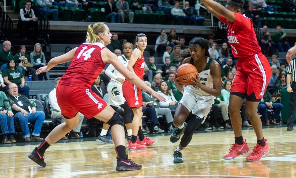 <p>Freshman guard Nia Clouden (24) drives for a layup against Ohio State. The Spartans lost to the Buckeyes, 70-77, Feb. 21, 2019 at the Breslin Center.</p>