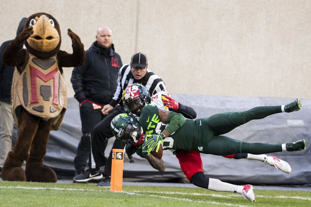 <p>Sophomore wide receiver Montorie Foster (83) makes the first touchdown of the game during the game against Maryland on Nov. 13, 2021, at Spartan Stadium. </p>