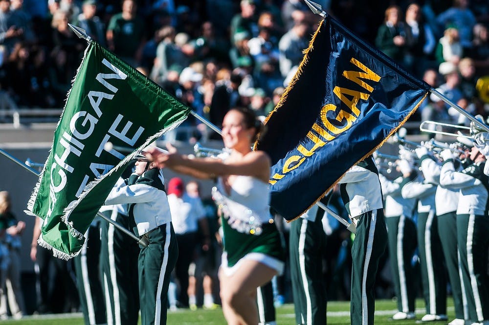 <p>The MSU Marching band performs Oct. 25, 2014, before the game against Michigan at Spartan Stadium. The Spartans defeated the Wolverines, 35-11. Erin Hampton/The State News </p>