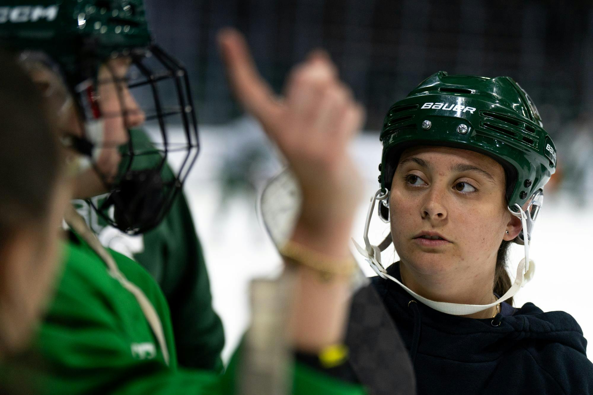 <p>Michigan State women's hockey head coach Theresa DiMaggio speaks with her players during a team practice at Munn Ice Arena, Sept. 19, 2024.</p>