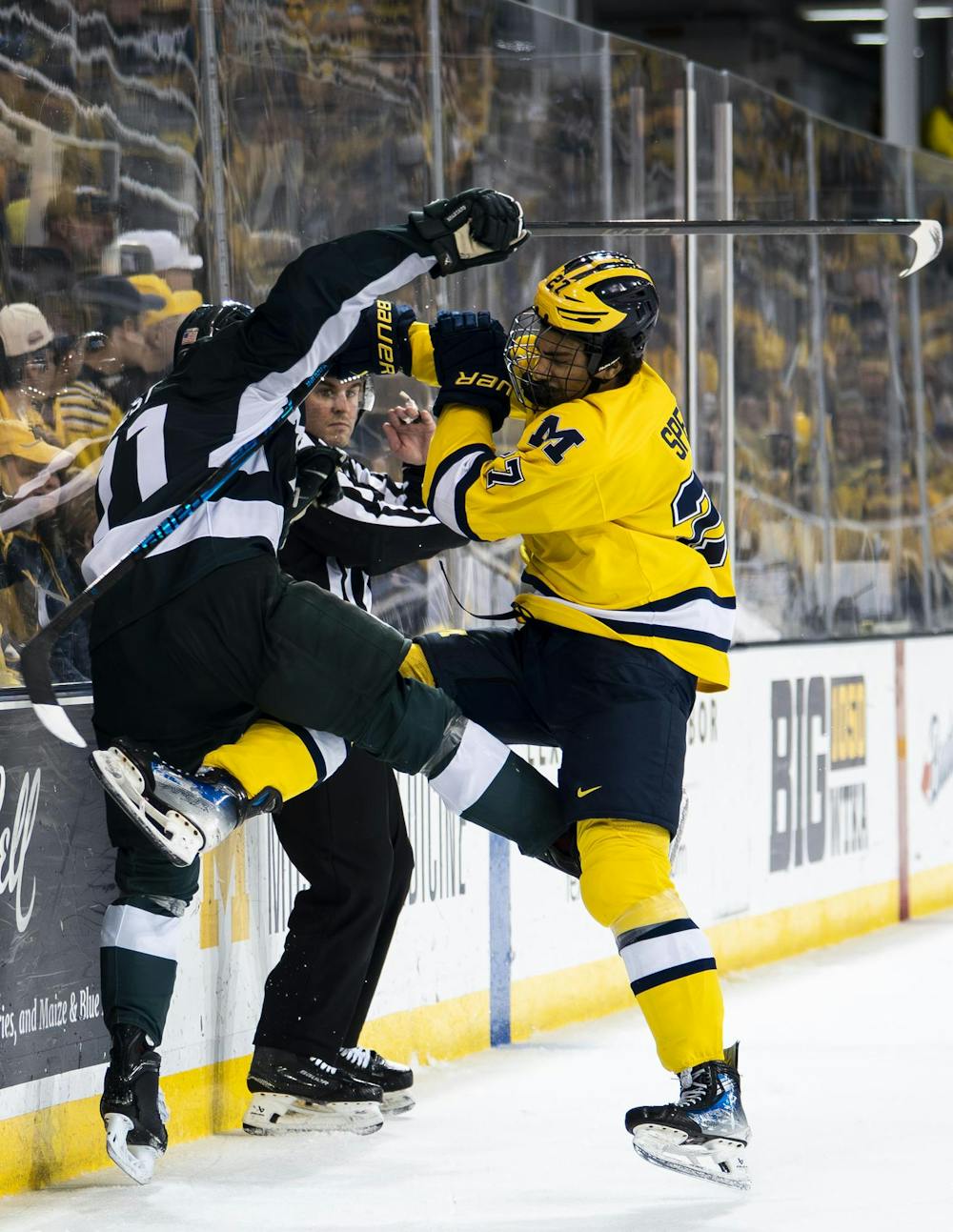 <p>Michigan State sophomore defense Owen West (11) and University of Michigan freshman forward Malcolm Spence (27) get in a fight at the Yost Ice Arena in Ann Arbor, Mich. on Dec. 6, 2025.</p>