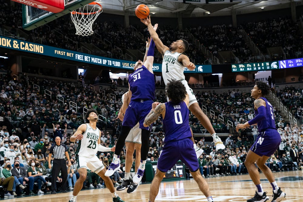 <p>Michigan State&#x27;s freshman guard Pierre Brooks (1) attempts to shoot the ball while being guarded by Northwestern&#x27;s junior forward Robbie Beran (31) during Michigan State&#x27;s loss on Jan. 15, 2022.</p>