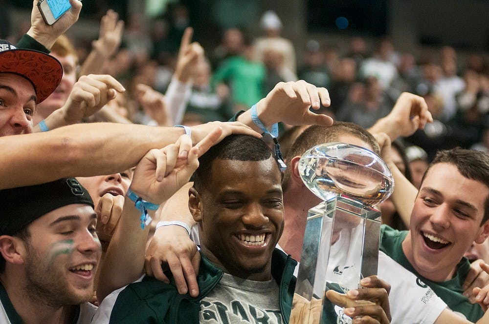 	<p>Members of the Izzone celebrate with sophomore defensive end Shilique Calhoun after he was presented with the National Defensive Performer of the Year award Jan. 7, 2014, at Breslin Center. Calhoun was honored during the second half, following the honoring of the team during halftime. Danyelle Morrow/The State News</p>