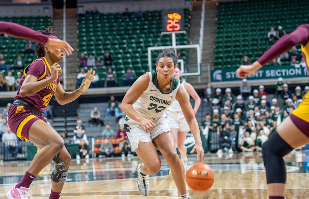 <p>Michigan State University graduate student guard Moira Joiner (22) drives to the basket and scores during their game matchup against&nbsp;Minnesota at the Breslin Center on Feb. 5, 2024. MSU would go onto win 76-65 against Minnesota.</p>