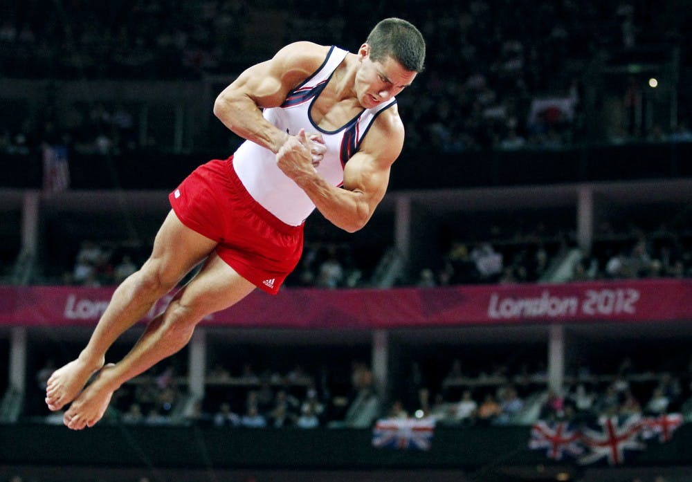 Jake Dalton soars as he competes in the vault during the team men's gymnastic artistic team final at the North Greenwich Arena for the Summer Olympics in London, England on Monday, July 30, 2012. (Vernon Bryant/Dallas Morning News/MCT)