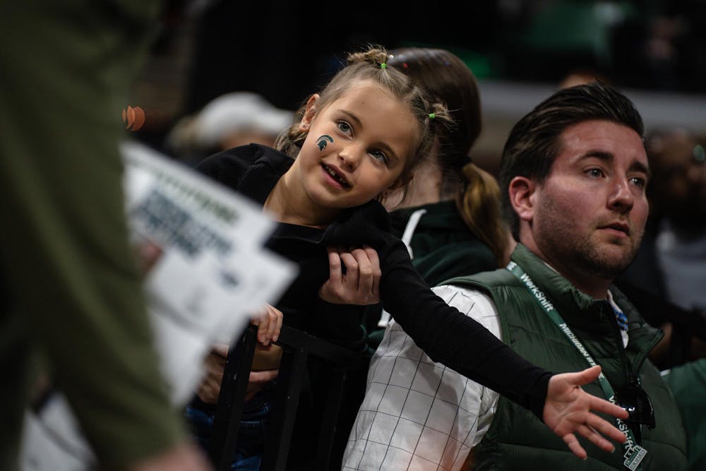 <p>A fan prepares to high-five Michigan State University's women's basketball team as they walk by for high fives at the Breslin Center in East Lansing, Michigan on Sunday, March 1, 2026.</p>