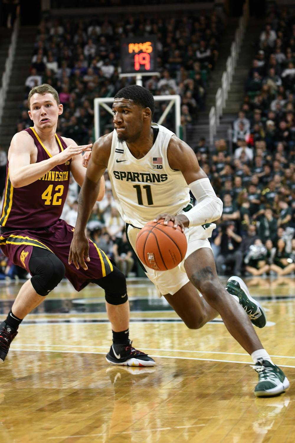 <p>Sophomore forward Aaron Henry (11) pushes through defenders during the game against Minnesota at the Breslin Center on Jan. 9. The Spartans defeated the Golden Gophers 74-58.</p>