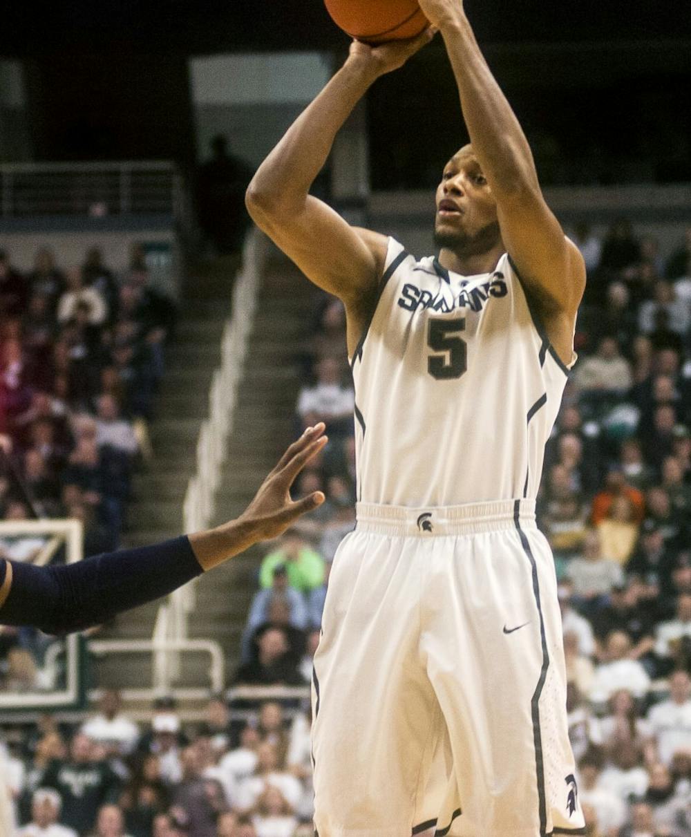 	<p>Senior forward Adreian Payne attempts a shot on Feb. 6, 2014, during the game against Penn State at Breslin Center. The Spartans defeated the Nittany Lions, 82-67. Erin Hampton/The State News</p>