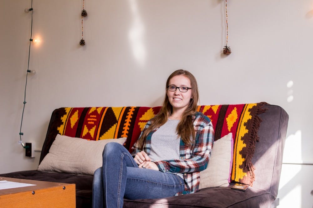 <p>Sustainable parks, recreation and tourism senior Molly Paquin sits in her dorm room on March 12, 2018. She's one of the few Native American students on campus and belongs to the Sault St. Marie Tribe of Chippewa Indians. She is pursuing an American Indian and Indigenous studies minor and plans to practice environmental law in the future . &nbsp;</p>