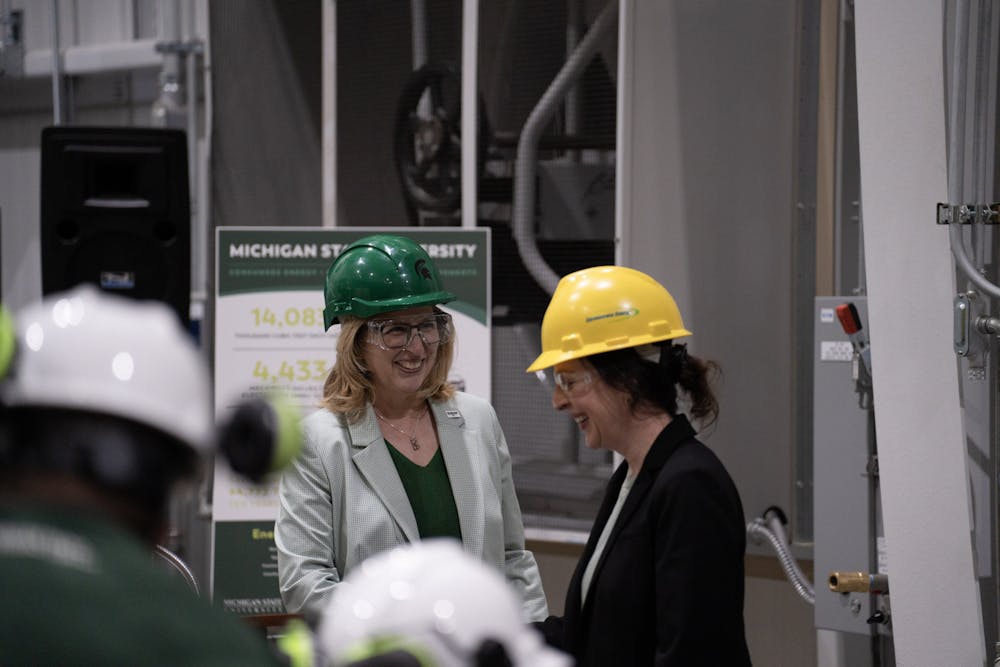 <p>Interim-President Teresa Woodruff meets Consumers Energy executives at MSU's Simon Power Plant at a media event on March 20th, 2023.</p>