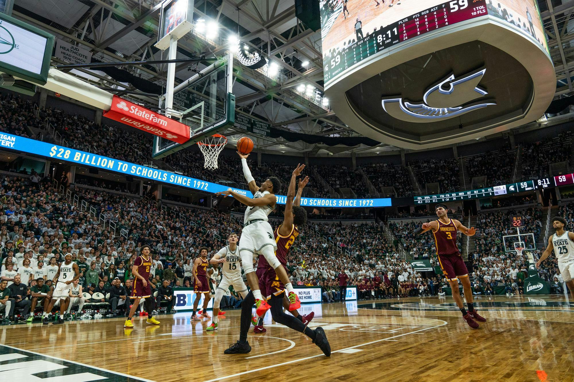 MSU guard Jaden Akins floats to the basket at the Breslin Center on Thursday, Jan. 18, 2024. The Spartans won 76-66 against Minnesota.
