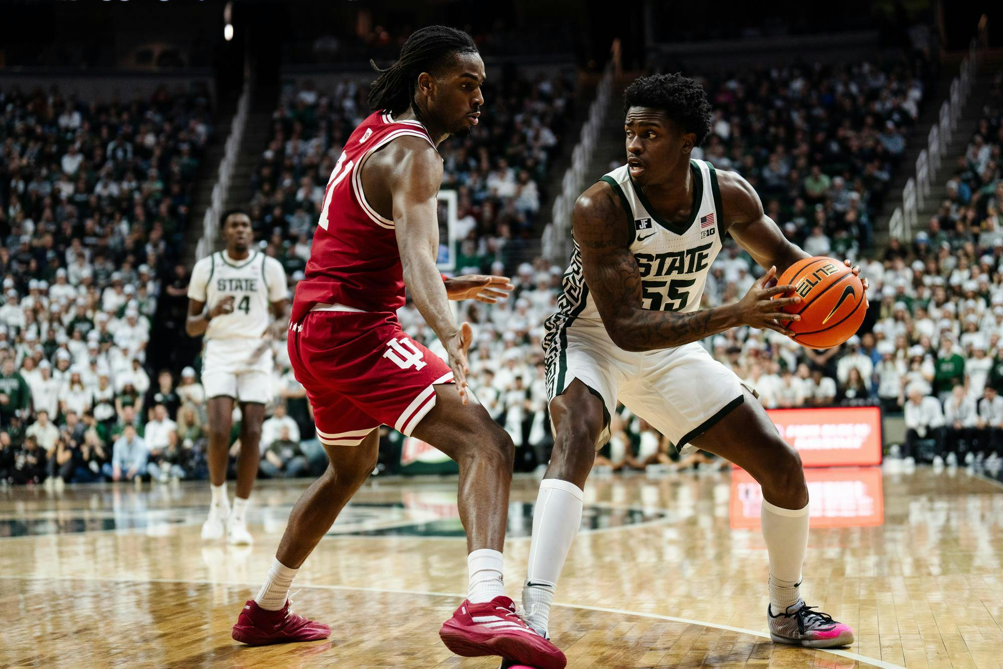 Michigan State sophomore forward Coen Carr (55) looks to pass the ball on Feb. 11, 2025. 