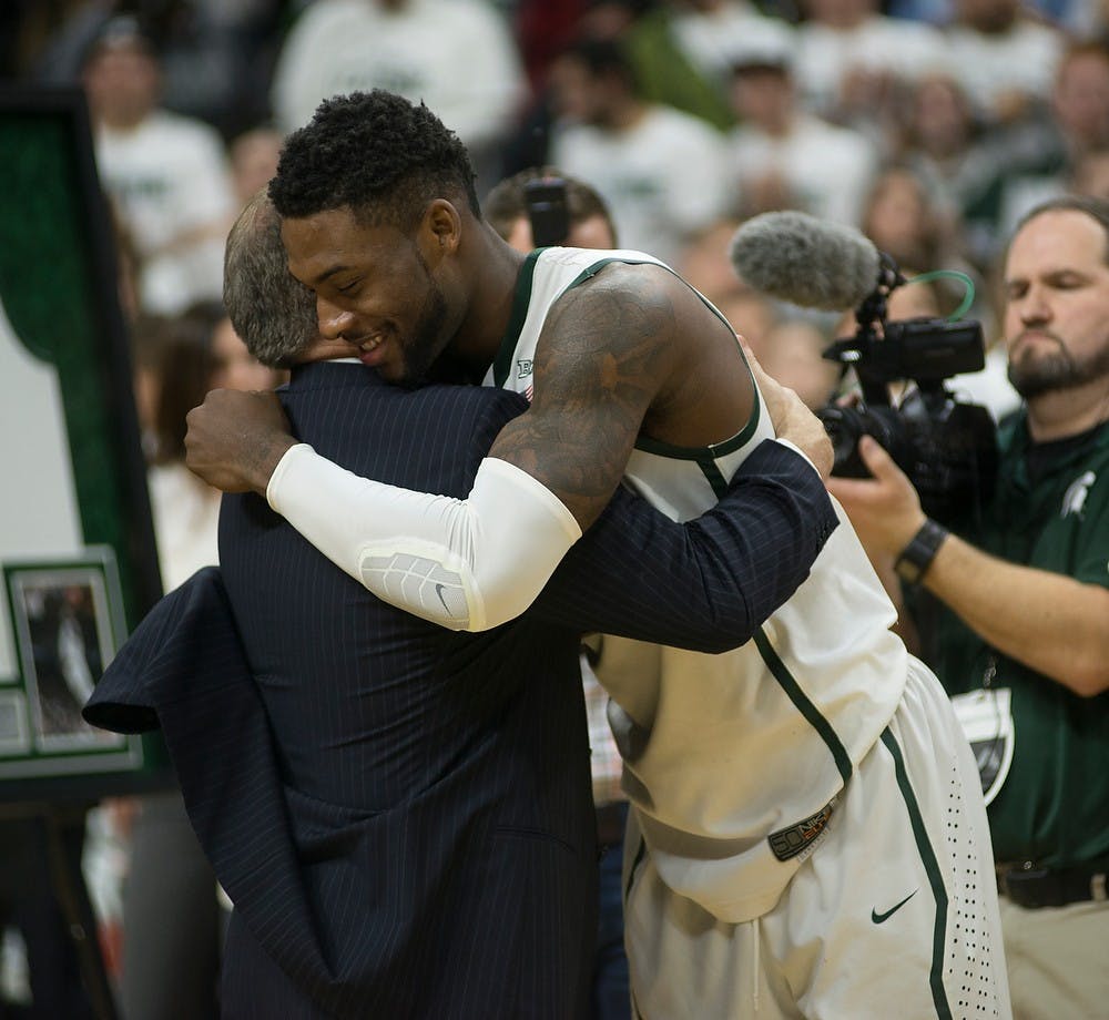 <p>Head coach Tom Izzo hugs senior guard/forward Branden Dawson on Mar. 4, 2015, during the senior night celebration at the game against Purdue at Breslin Center. The Spartans defeated the Boilermakers, 72-66. Emily Nagle/The State News</p>