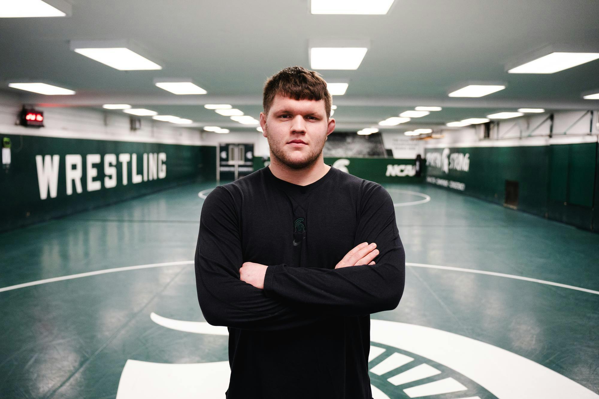 <p>Redshirt Freshman Wrestler Josh Terrill poses for a portrait on the wrestling mat at IM West on Feb. 15, 2024.</p>