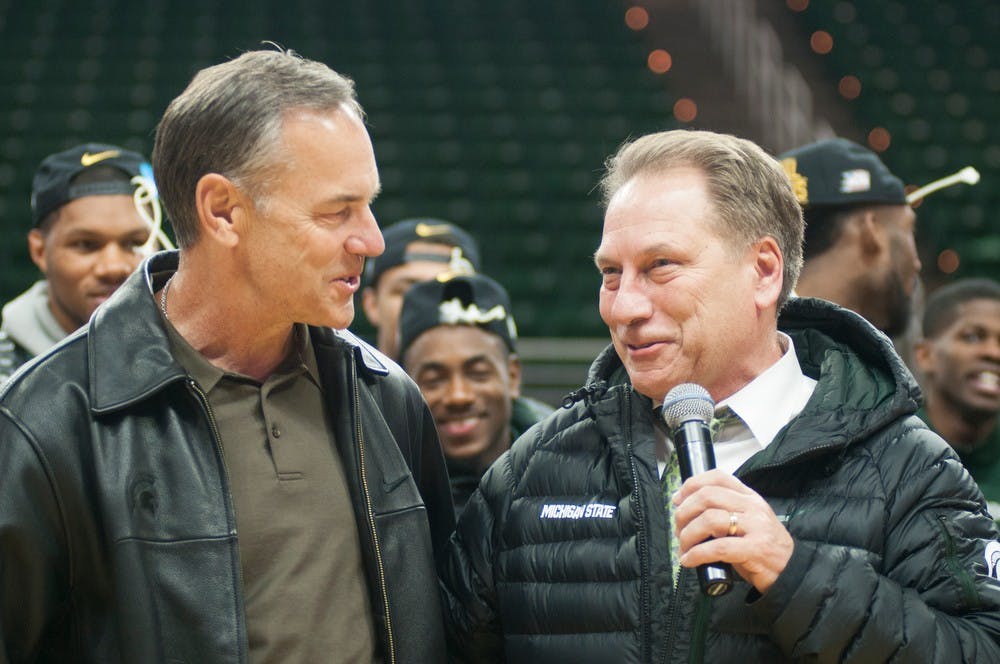 <p>Head Coach Tom Izzo discusses national championships with head football coach Mark Dantonio March 29, 2015, during the celebration of MSU's win over Louisville at Breslin Center. The win advanced the team to the Final Four in Indianapolis, Indiana. Kennedy Thatch/The State News</p>