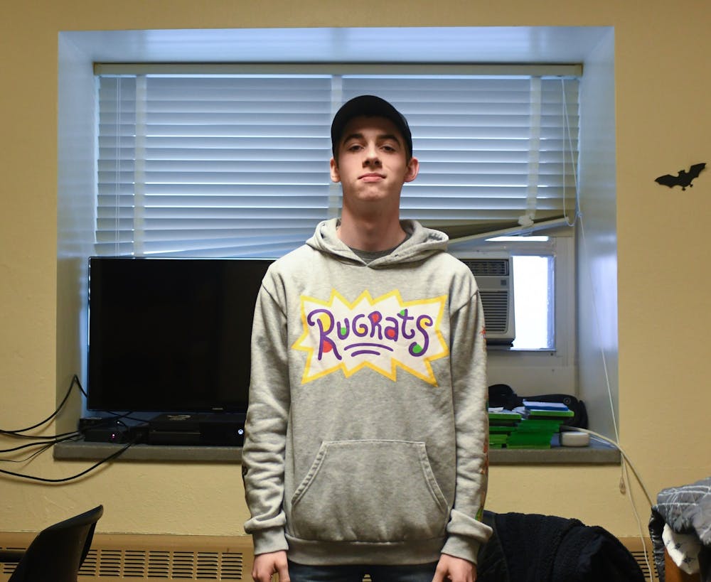 Elijah McKown poses for a portrait in his room in Hubbard Hall on February 26, 2020. 