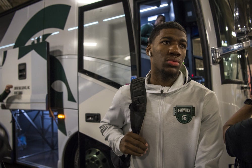 <p>Freshman forward Aaron Henry (11) walks off the bus as the men&#x27;s basketball team arrives to U.S. Bank Stadium before their NCAA Final Four game against Texas Tech in Minneapolis on April 6, 2019. (Nic Antaya)</p>