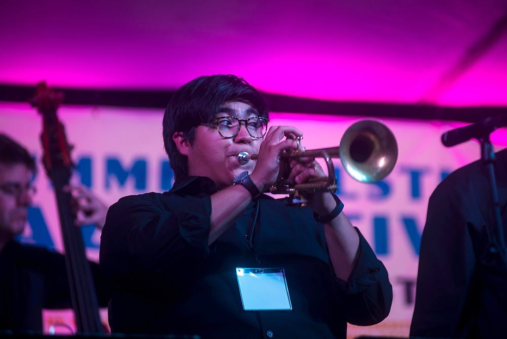 <p>Jazz studies senior Walter Cano performs June 21, 2014, during the Jazz Festival on Albert Rd. Cano was one of many students performing at the Jazz Festival during the weekend. Hayden Fennoy/The State News</p>