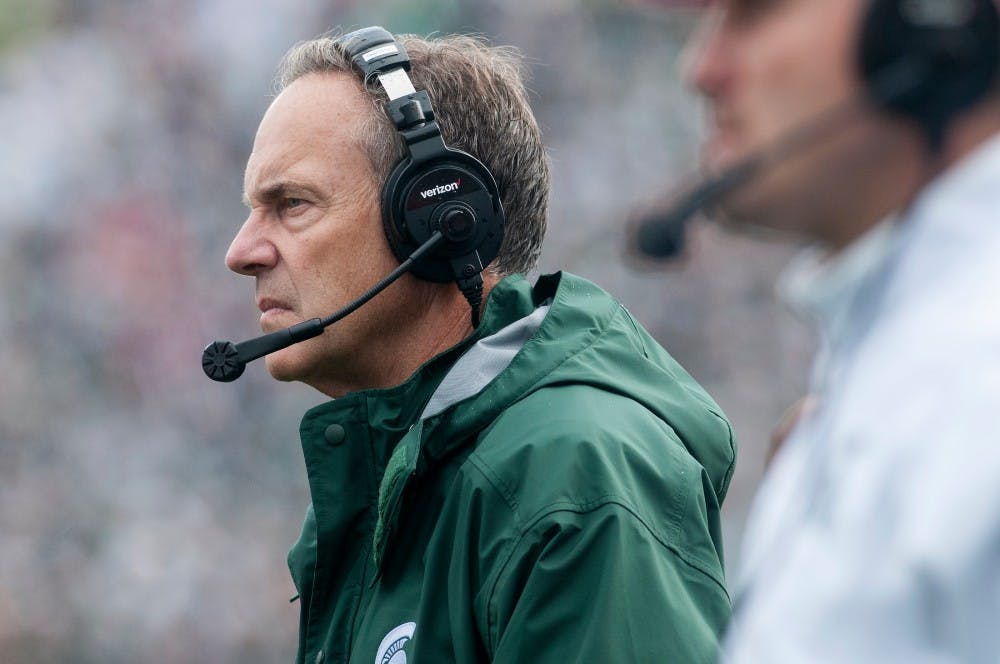 <p>Head coach Mark Dantonio reacts to an Indiana touchdown during the game against Indiana on Oct. 24, 2015, at Spartan Stadium. The Spartans defeated the Hoosiers, 52-26.</p>