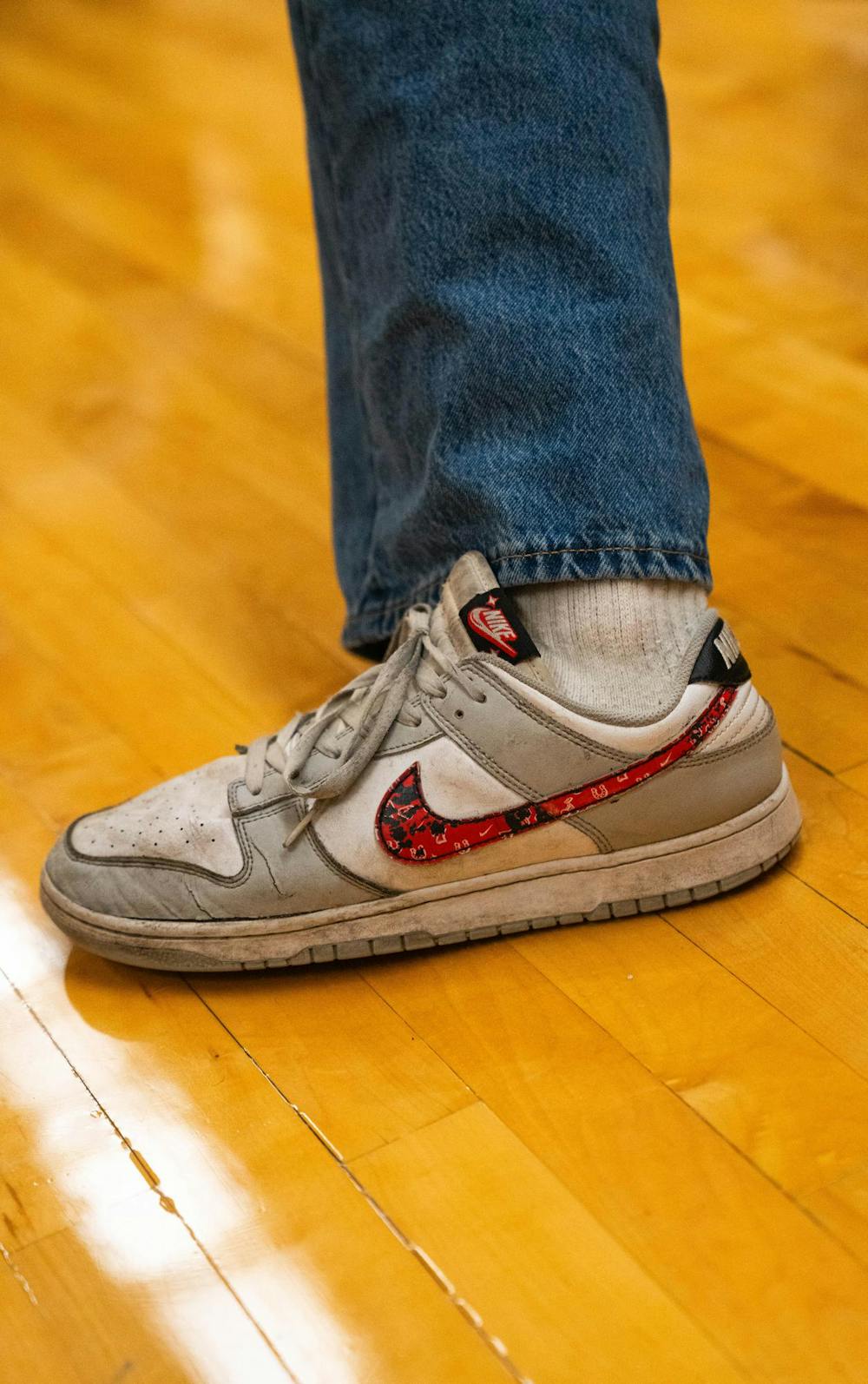 A dancer kicks out his foot while dancing at IM Circle, in East Lansing, on Dec. 2nd, 2025.