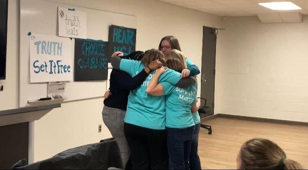 <p>Survivors embrace after the Board of Trustees voted to release the thousands of documents relating to disgraced ex-MSU doctor Larry Nassar on Dec. 15, 2023.</p>