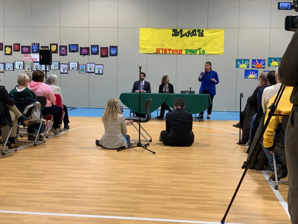 <p>Behind table, from left to right: Michigan Secretary of State legal policy director Jonathan Brater, End Citizens United president Tiffany Muller and U.S. Rep. Elissa Slotkin, D-Michigan, discuss H.R. 1, to limit corporate financial influence in politics, at a public forum at Lansing&#x27;s Pattengill Biotechnical Magnet School March 15, 2019. <strong>Photo by S.F. McGlone</strong></p>