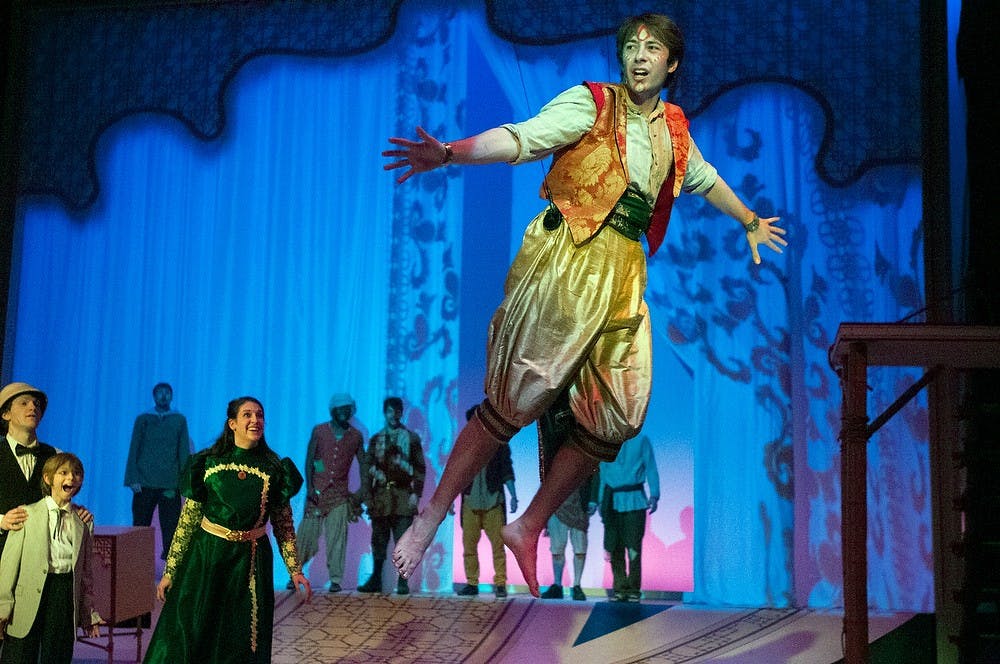 <p>Theatre junior Joshua Whitson flies in the air during dress rehearsal in Peter Pan on April 9, 2014, at Wharton Center. Whitson plays Peter. Allison Brooks/The State News</p>