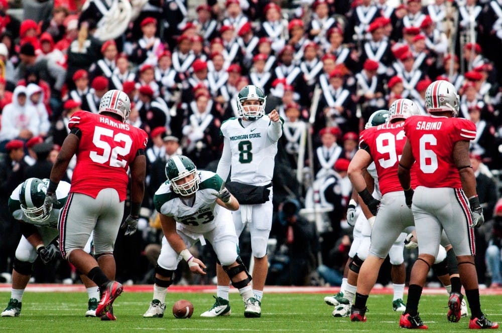 Senior quarterback Kirk Cousins calls an audible at the line of scrimmage. The Spartans defeated Ohio State, 10-7, for the first time since 1999 on Saturday afternoon at Ohio Stadium in Columbus, Ohio. Josh Radtke/The State News