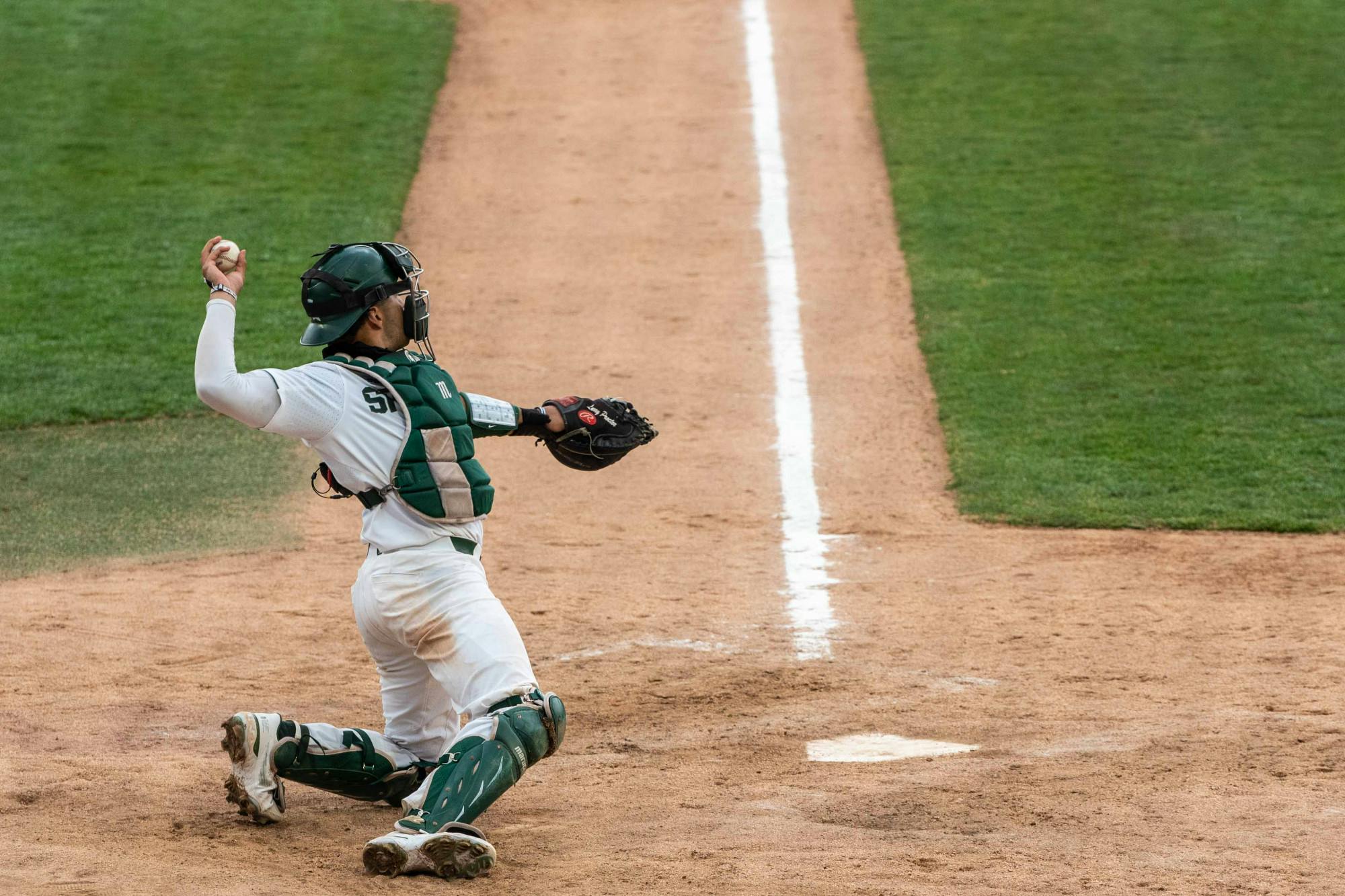 Sotres warms up with Michigan State pitcher Erla after the rain delay. The Spartans excelled against the Nittany Lions and won 7-4 at McLane Baseball Field on April 9, 2021.