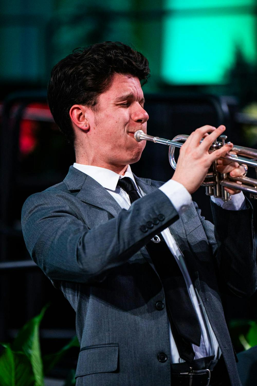 An MSU student performs a trumpet solo moments before the fall 2024 commencement ceremony at the Breslin Center on Dec. 14, 2024.