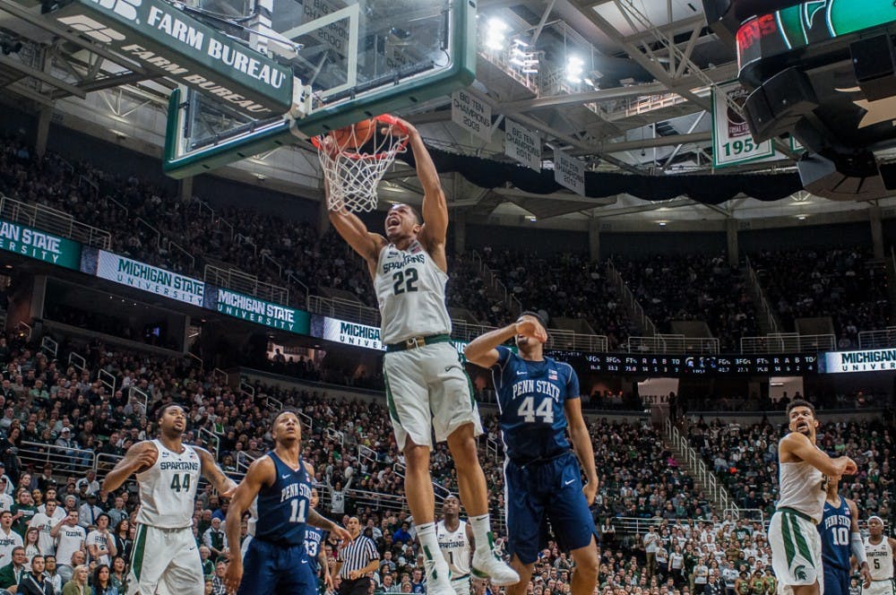 Sophomore guard Miles Bridges (22) dunks the ball during the game against Penn State on Jan. 31, 2018 at Breslin Center. The Spartans trailed the Nittany Lions at 30-24 at halftime. 