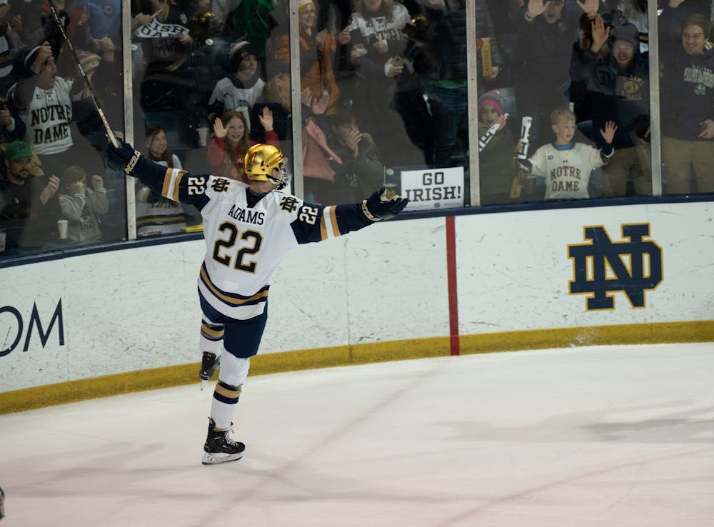 <p>Notre Dame graduate student forward Jack Adams celebrates after assisting junior forward Grant Silianoff on Notre Dame's game-winning second-period goal in the low-scoring 1-0 victory of MSU.</p>