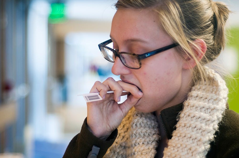 	<p>International studies in social science junior Tara Schultz swabs her cheeks for cells while registering to be a marrow donor Jan. 29, 2014, in Wells Hall. Both of Richter&#8217;s daughters have leukemia, including <span class="caps">MSU</span> alumna Jessalyn Richter has Acute Myeloid Leukemia. Erin Hampton/The State News</p>