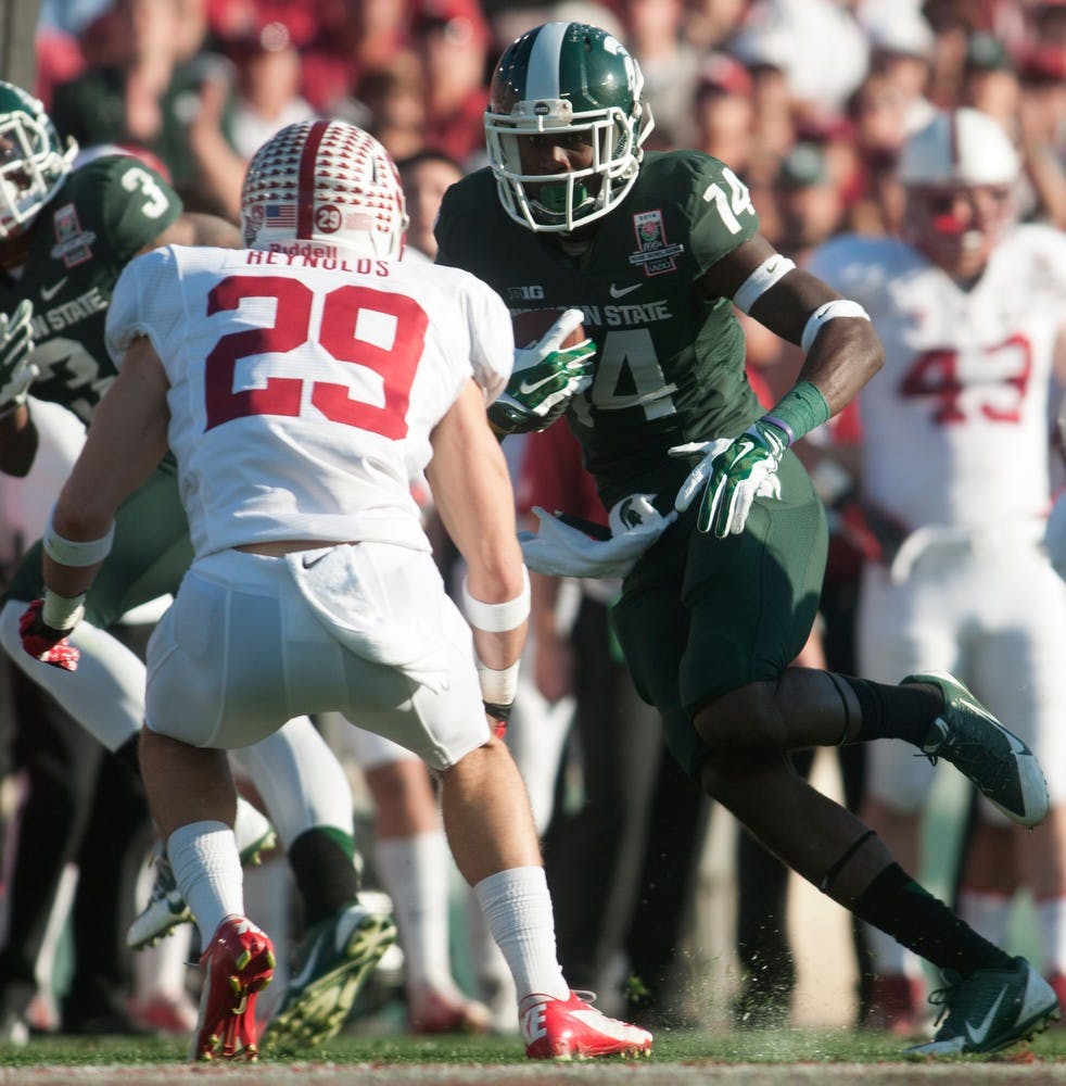 	<p>Junior wide reciever Tony Lippett looks to get around Stanford safety Ed Reynolds at the 100th Rose Bowl game on Jan. 1, 2014, in Pasadena, Calif. The Spartans defeated the Cardinal, 24-20. Julia Nagy/The State News</p>