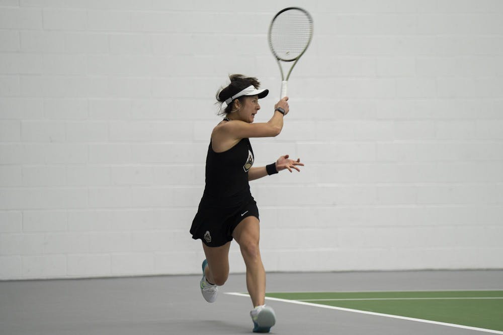 Purdue 5th year tennis player Csilla Fodor takes the lead during singles at the MSU Tennis Facility on Mar. 30, 24.
