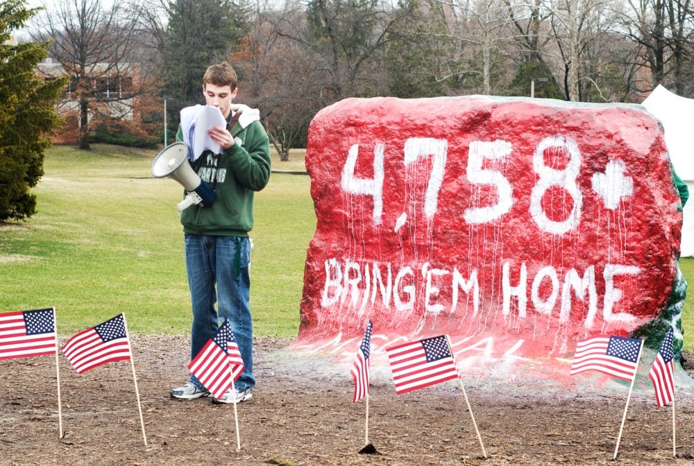 	<p>Political theory and constitu-tional democracy freshman CJ Galdes reads a list of soldiers who died in the recent wars at a protest at the rock on Farm Lane on Monday held by the <span class="caps">MSC</span> Libertarians.</p>